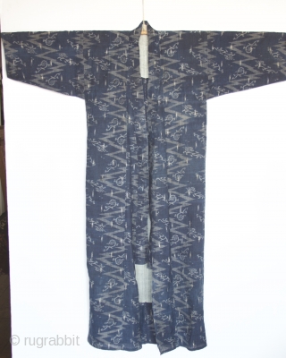 Japanese Kimono, very fine indigo color. I believe the fabric is ramie. It is an Ikat called Katsuri.  

Excellent condition even though it is old.  There is one patch which  ...