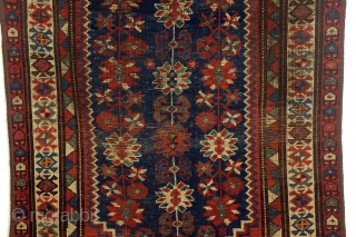 Shirvan, Caucasus, 100 years old,, 186 x 106 cm.
6.2 ft. x 3.5 ft. wool on wool knotted. Natural dye. Low pile, the edges festooned again.        