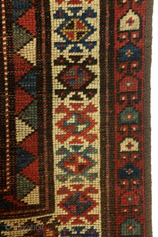 Shirvan, Caucasus, 100 years old,, 186 x 106 cm.
6.2 ft. x 3.5 ft. wool on wool knotted. Natural dye. Low pile, the edges festooned again.        