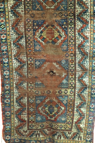 Karabach, 1900 - 1915, beautifully worn rug. 190 x 101 Cm. 
Border with Zoroast symbols, fire and fire torch. 
             