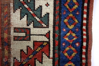 Caucasus, Kuba area, early 20th century. 
170 x 100 Cm. Wool on wool. 
Gracefully fading away in time. 
Zoroastic symbols in the border. 
'Barber pole' stripes with swastica's, solar symbols.   