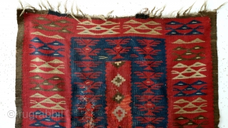 Rare and fine 1850 - 1870 Bulgarian kilim. 
it has an old band sewn on with brass rings.
Always was a wall hanging - it preserved this kilim. 
'as is". 
94 x 180  ...