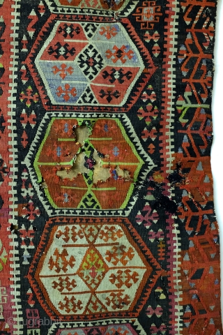 Kilim, Anatolia, fragment, as is, sewn on a protecting cloth at the back. 
280 x 167 Cm. old repairs.              