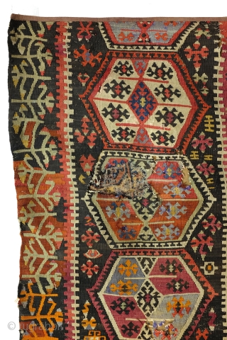 Kilim, Anatolia, fragment, as is, sewn on a protecting cloth at the back. 
280 x 167 Cm. old repairs.              