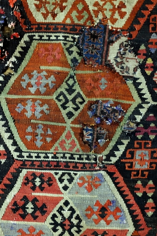 Kilim, Anatolia, fragment, as is, sewn on a protecting cloth at the back. 
280 x 167 Cm. old repairs.              