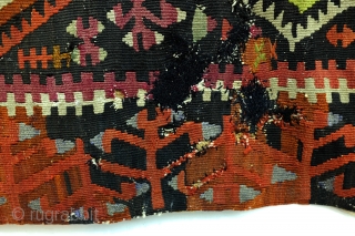 Kilim, Anatolia, fragment, as is, sewn on a protecting cloth at the back. 
280 x 167 Cm. old repairs.              