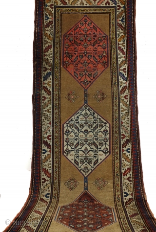 Antique runner Kazak, Derbent north Caucasus. 
290 x 110 Cm. .6 ft. x 3.6 ft. 
Wool on wool. 
crispy details. 
1900-1920. 

On a camel field 3 hexagon medaillons. 
Natural camel wool. 
In  ...