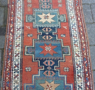 Antique NW-Persian/ Caucasian runner, 312  x 105 cm., 10'3" x 3'5" on woolen ground. With some wear and with all natural dyes. One older repair ( see pict. 3). Washed.  