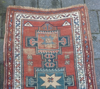 Antique NW-Persian/ Caucasian runner, 312  x 105 cm., 10'3" x 3'5" on woolen ground. With some wear and with all natural dyes. One older repair ( see pict. 3). Washed.  