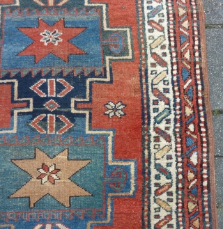 Antique NW-Persian/ Caucasian runner, 312  x 105 cm., 10'3" x 3'5" on woolen ground. With some wear and with all natural dyes. One older repair ( see pict. 3). Washed.  