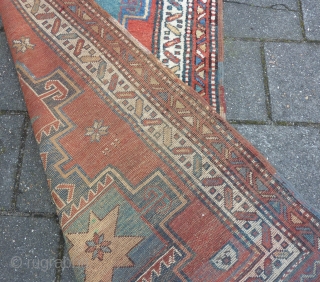 Antique NW-Persian/ Caucasian runner, 312  x 105 cm., 10'3" x 3'5" on woolen ground. With some wear and with all natural dyes. One older repair ( see pict. 3). Washed.  