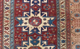 Antique Kuba Lesghi with Kufic border, 204  x 131 cm., 6'8" x 4'4", ca. 1900. Good pile with corroded browns and some scattered wear. In the center three repaired slits and  ...