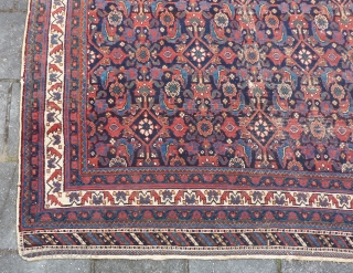 Afshar herati rug, 233  x 170  cm., 7'8" x 5'7", ca. 1900, with great, saturated colours. With wear and a kind of repaired 3 feet long slit (?) in the  ...