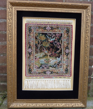 Fine 15 x 15 knts. p/cm. silk on silk Hereke, signed Özipek in its original frame, Seize frame:  60  x 47 cm., Seize rug: 34  x 26 cm. Mint  ...