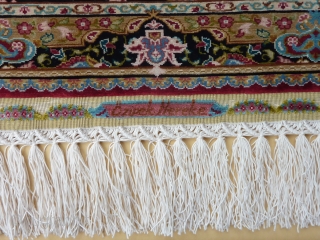 Fine 15 x 15 knts. p/cm. silk on silk Hereke, signed Özipek in its original frame, Seize frame:  60  x 47 cm., Seize rug: 34  x 26 cm. Mint  ...