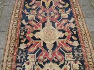 Early Caucasian Kuba kelleh, 19th c., 333 x 135 cm., 10'11" x 4'6". On woolen structure and with a few old repairs. All natural dyes.        