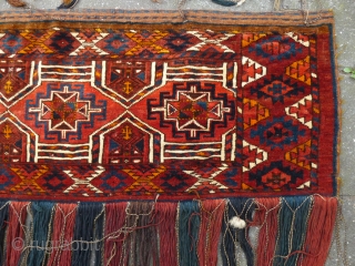 Kizil Ayak(?)Torba with a genuine shamanistic touch by attached pieces of rabbit(?)skin to the fringe. Ca. 1920s. Very good condition and pile. In my opinion all natural dyes, except probably for a  ...