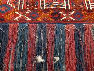 Kizil Ayak(?)Torba with a genuine shamanistic touch by attached pieces of rabbit(?)skin to the fringe. Ca. 1920s. Very good condition and pile. In my opinion all natural dyes, except probably for a  ...