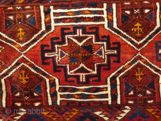 Kizil Ayak(?)Torba with a genuine shamanistic touch by attached pieces of rabbit(?)skin to the fringe. Ca. 1920s. Very good condition and pile. In my opinion all natural dyes, except probably for a  ...