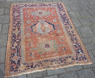 Charming Karaja rug 190  x 153 cm., 6' 3" x 5', around 1900. Alas not in pristine condition: with lot of wear. Also two hardened glue areas at one ending at  ...
