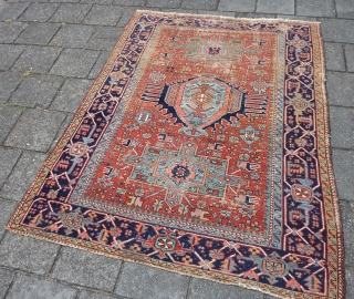 Charming Karaja rug 190  x 153 cm., 6' 3" x 5', around 1900. Alas not in pristine condition: with lot of wear. Also two hardened glue areas at one ending at  ...