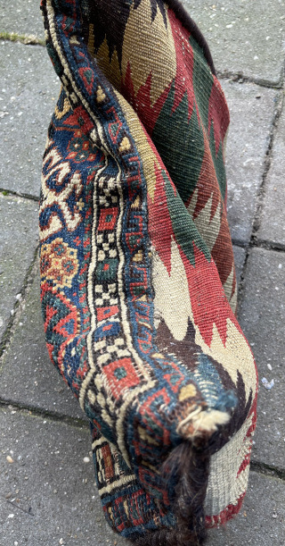 Antique Qashqai Bag + its original kilim backside, made in to a pillow. Low pile and one area with wear ( detail pict.). Last picture in full sunshine. robvanwieringen@telfort.nl    