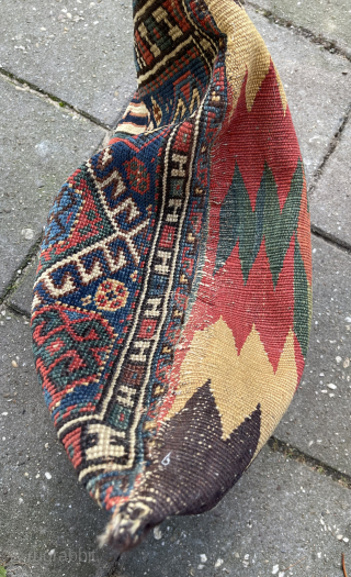 Antique Qashqai Bag + its original kilim backside, made in to a pillow. Low pile and one area with wear ( detail pict.). Last picture in full sunshine. robvanwieringen@telfort.nl    