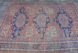 Dated Kuba Sumakh 1877 ( 1294 ), 280 x 198 cm., 9' 2" x  6' 6". With patches, damages and lots of joyfully used faded early fuchsine dye.    