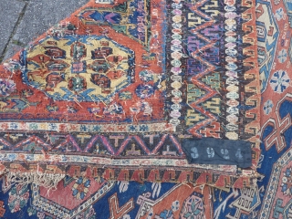 Dated Kuba Sumakh 1877 ( 1294 ), 280 x 198 cm., 9' 2" x  6' 6". With patches, damages and lots of joyfully used faded early fuchsine dye.    