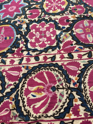 Lovely Suzani, Khujand, North-Tajikistan, 244 x 174 cm., mid 19th c. Silk embroidery on handspun cotton (6 panels) with all natural dyes (11), with cochineal being the dominant colour.
Some smaller damages: all  ...