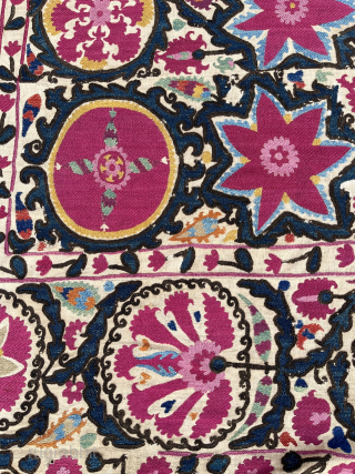 Lovely Suzani, Khujand, North-Tajikistan, 244 x 174 cm., mid 19th c. Silk embroidery on handspun cotton (6 panels) with all natural dyes (11), with cochineal being the dominant colour.
Some smaller damages: all  ...