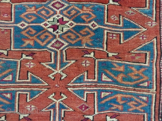 Bergama, 134  x 114 cm., 4' 5" x 3' 9", mid 19th c., with lots of cochenille in the border. Nice positive-negative reciprocity. Sides redone, two little holes, one tiny repair.  ...