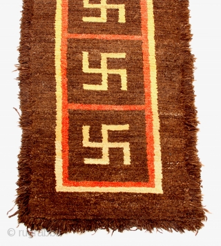 TC 20 - Warp-faced Back Carpet:

35”  x   62”
Tibet - 19th C.
Wool pile Khaden with yungdrung (swastika) design                