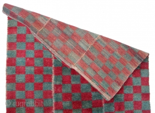 Tsukdruk Red & Green Checkered Khaden (TC01) 
31 1/2” x 63 1/4” 
Cut-pile checkered tsukdruk Khaden (sleeping size) Carpet 
3 panels of red & green checked design.
Condition: Well used but solid condition.  ...