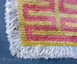 Tibet: Warp-faced Back Carpet (TC21)

80”  x   39”
19th c. Wool pile warp-faced back ‘Wangden’ - Yellow ground with Red key design.  The ’fringe' is a faded blue but otherwise  ...