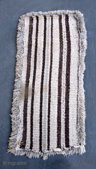 Tibet: Warp-faced Back Carpet (TC21)

80”  x   39”
19th c. Wool pile warp-faced back ‘Wangden’ - Yellow ground with Red key design.  The ’fringe' is a faded blue but otherwise  ...