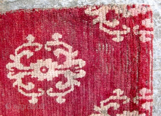 Tibetan Carpet (TC13)
Wine colored fragment with stylized dorje design.
Well used but solid condition.
31 1/2”  x  21 1/2”
POR              