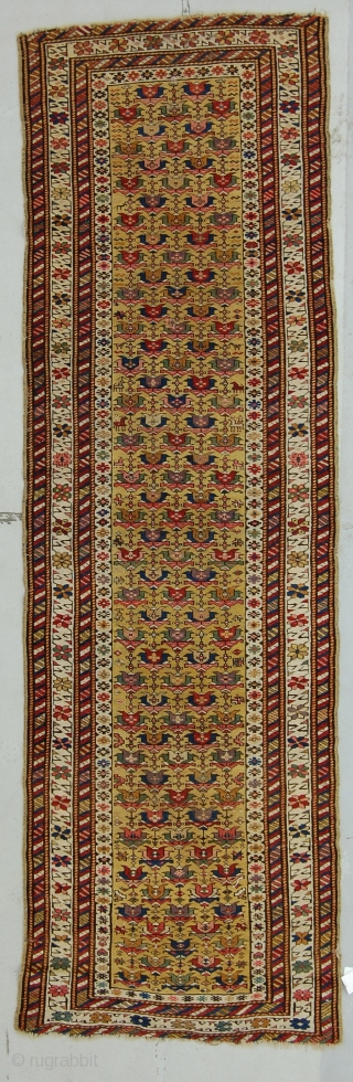 3' x 10' E. Caucasian rug, clear yellow ground with soft purple. Flat to the top, end slightly reduced, very small patch.           