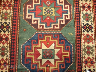 #7198 Kazak Antique Caucasian Rug 
This third-quarter 19th-century Kazak measures 4’2” X 8’5” (128 x 259cm). It has four memling gul medallions, one on a blue ground, one on an aubergine ground,  ...