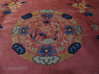 This circa 1930 Art Deco Chinese handmade wool Oriental Rug #8185 measures 8’0” X 10’10”. It has a lovely floral design with sprigs of flowers throughout the field complete with four butterflies  ...