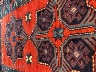 This Armenian Kazak antique Caucasian Oriental #8103 rug dated 1913 measures 3’9” x 6’8” has a red ground with an an inscription and three 8 pointed stars running up the field displaying  ...
