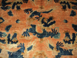 This Ningxia Chinese Oriental rug #7273 measures 6’3” x 9’2”. It has 9 five toed dragons in blue on an orange gold ground. Sacred mountain meditation points quarter the rug and are  ...
