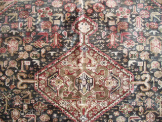 This circa 1900 Keyseri #6448 measures 4’0” X 6’2”. It has a Qashqai design with a dark blue field with four medallions, two red and two ivory. , on an ivory ground  ...
