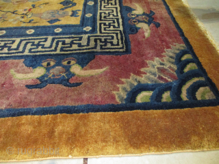This circa 1920 handmade wool Art Deco Chinese Oriental Rug #8159 measures 8’0” X 9’10”. It has a golden yellow brown field and an extremely interesting layout. There is a dragon at  ...
