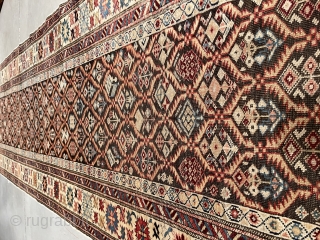 This circa 1875 Kuba Runner #7414 measures 3’2” X 13’2” (97 x 401 cm). This is an interesting long rug. It has a latticework design containing innumerable different flower motifs worked in  ...