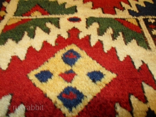 This third quarter 19th century Borchalou Kazak #7775 antique Oriental Caucasian carpet measures 5’2” X 7’5” (158 x 229 cm). The three panel field consists of two red squares flanking a green  ...