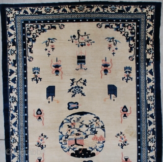 #7263 Antique Peking Chinese Rug 
This circa 1900 Peking Chinese Oriental carpet measures 7’2” x 12’1”. It has an ivory field containing various Buddhist iconographies including the beribboned umbrella, paint boxes, standing  ...