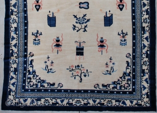 #7263 Antique Peking Chinese Rug 
This circa 1900 Peking Chinese Oriental carpet measures 7’2” x 12’1”. It has an ivory field containing various Buddhist iconographies including the beribboned umbrella, paint boxes, standing  ...