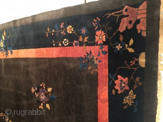 This circa 1930 Peking Chinese rug #7850 measures 9’0” X 11’5”. It has a deep chocolate brown field with five multi-colored flower sprays in the field, one of which is a beautiful  ...