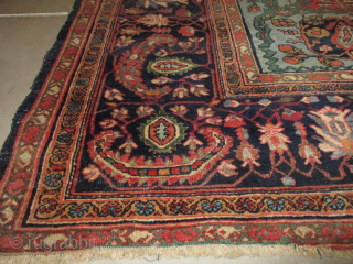 Antique Fereghan Sarouk 8’4” X 11’5” #8124 This last quarter 19th century Fereghan Sarouk measures 8’4” X 11’5”. It has a dark red floral motif field filled with a rose, green and  ...